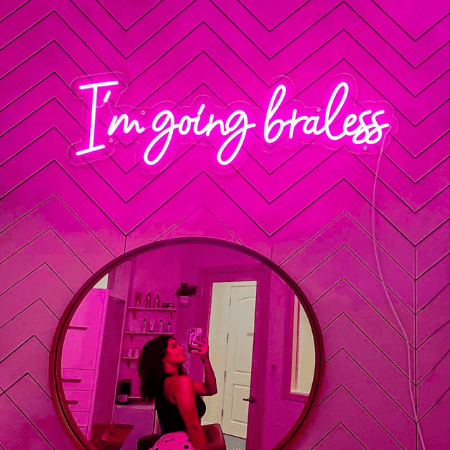pink neon sign on the bedroom wall